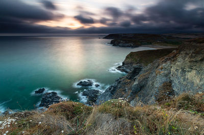 Scenic, long exposure view of sea against sky during sunset