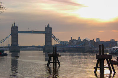 View of bridge over river against cloudy sky