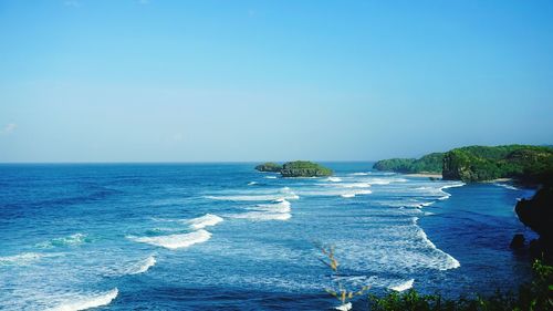 Scenic view of sea against blue sky