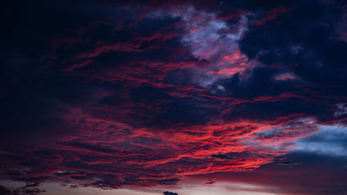 Low angle view of dramatic sky during sunset