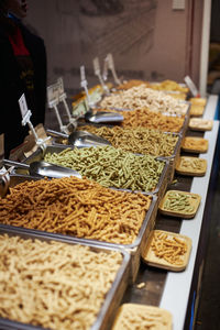 Fried snacks for sale at market stall