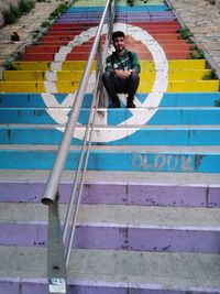 Portrait of smiling man on steps