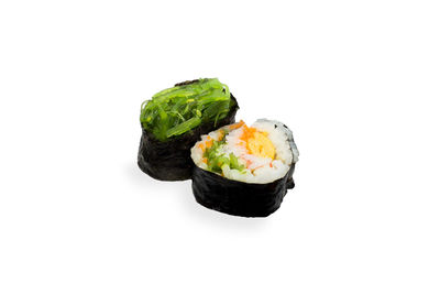 Close-up of sushi against white background