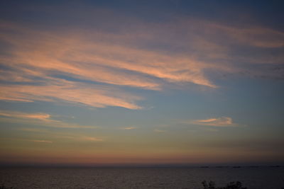 Scenic view of sea against sky at sunset