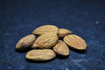 Close-up of fruits on table against black background