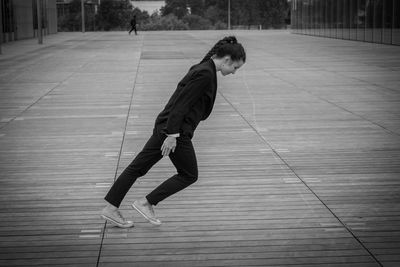 Young woman dancing outdoors