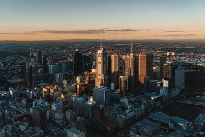 High angle view of city buildings during sunset