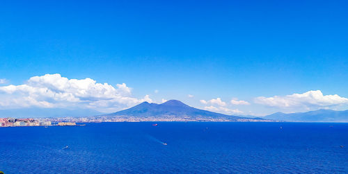 Scenic view of sea against blue sky