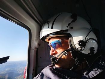 Portrait of man seen through airplane window