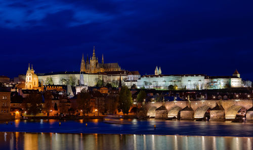 Illuminated buildings in city at night