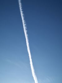 Low angle view of vapor trail in sky