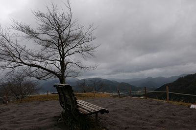 Scenic view of mountains against cloudy sky