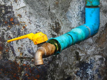 High angle view of yellow pipe on wall