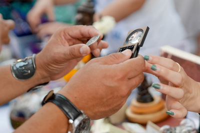 Cropped hands of man using mobile phone