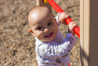 Baby boy playing at playground outdor