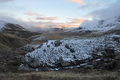 Scenic view of mountains against sky during winter