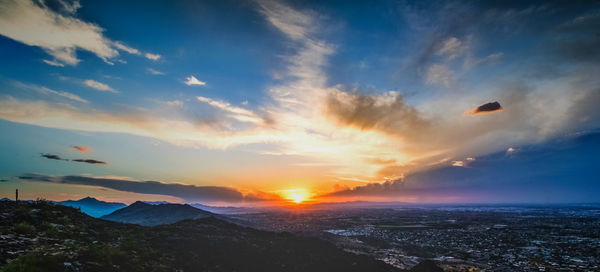 Scenic view of sunset over city