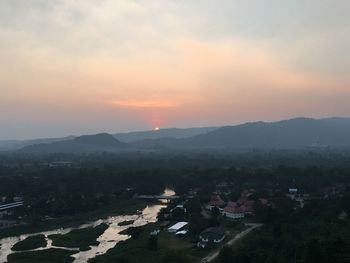 High angle view of river against sky at sunset