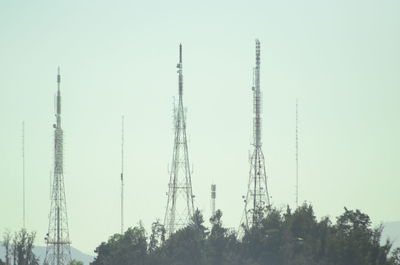 Low angle view of communications tower against sky