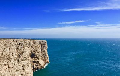 Scenic view of sea against blue sky