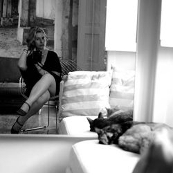 Young woman sitting in bathtub