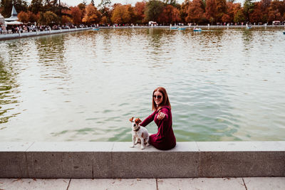 Young woman sitting on a lake