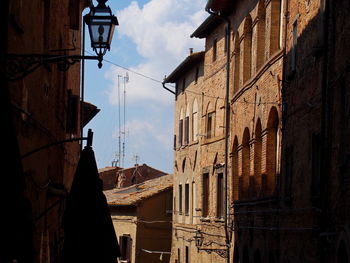 Low angle view of buildings in city against sky