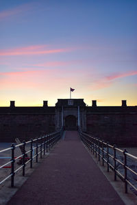 View of historic building against sky during sunset