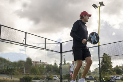 Man holding padel racket