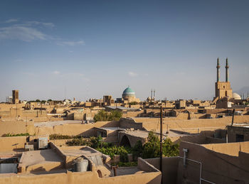 View of buildings in city against sky