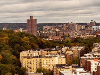 Buildings in city against sky