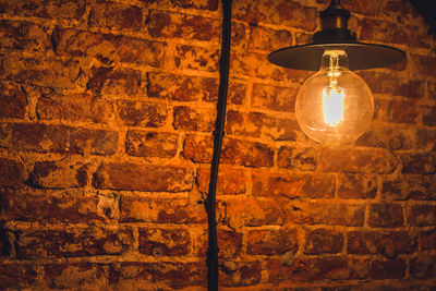 Low angle view of illuminated light bulb