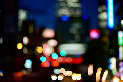 Defocused image of illuminated lights at night