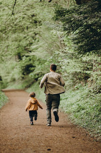 Rear view of boys walking 
