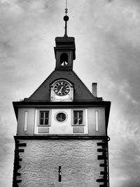 Low angle view of bell tower against sky