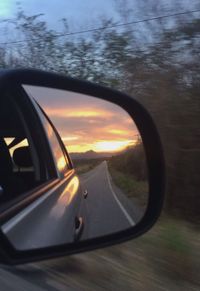 Reflection of car on side-view mirror