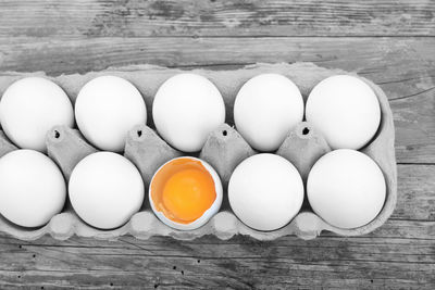 High angle view of eggs in carton on table