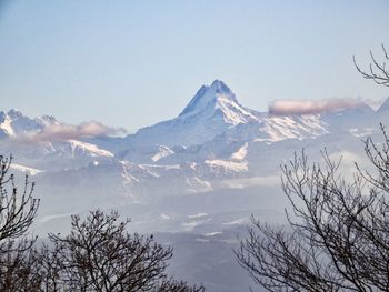 Scenic view of snowcapped mountains against sky