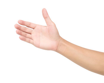 Close-up of human hand over white background