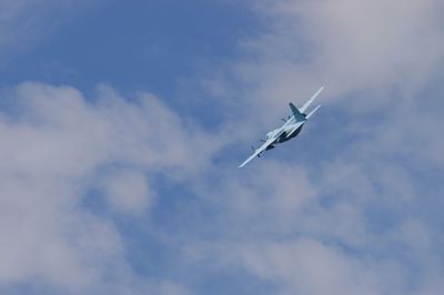 Low angle view of airplane flying in sky