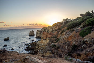 Scenic view of sea against sky at sunset