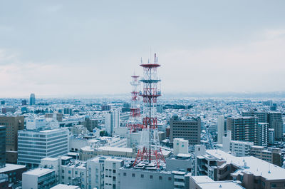 High angle view of buildings in city against sky