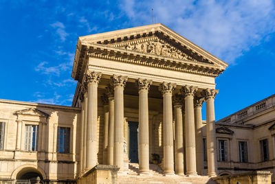 Low angle view of historical building against cloudy sky