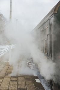 Train on railroad track in fog