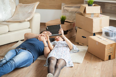 Portrait of woman sitting on sofa at home