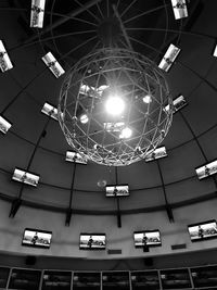 Low angle view of illuminated pendant lights hanging from ceiling