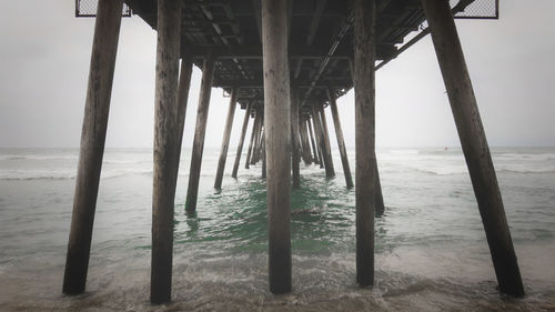 Scenic view of pier over sea against sky