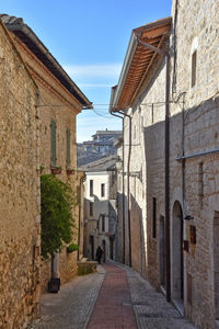 A street narrow between the old houses of veroli, medieval village in lazio region, italy.