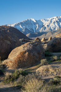 Scenic view of snowcapped mountains against clear sky