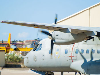 Close-up of airplane against clear blue sky